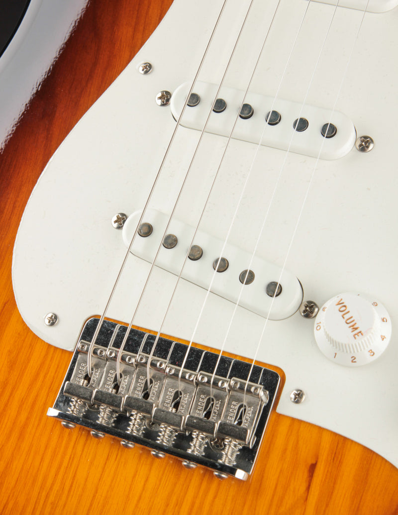Close up picture of the bridge and pickups of a Fender Vintage Custom &