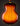 Close-up of a guitar's back with a sunburst finish on a dark background