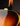 Close-up of a guitar's body and neck on a dark background