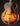 Vintage archtop guitar with a sunburst finish on a black background