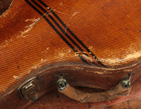 Close up of handle on a vintage electric guitar case