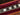 Guitar neck in a red case on a wooden surface