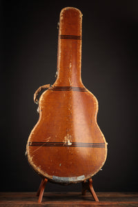 Vintage guitar case with a dark background