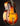Vintage archtop guitar with a sunburst finish on a black background