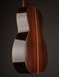 Back and sides on a Martin acoustic guitar against a black background