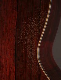 Close-up of a guitar with a focus on the grain and texture.