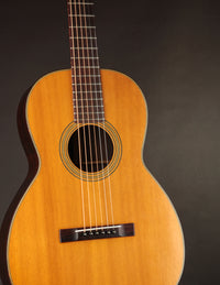 Martin acoustic guitar on a black background