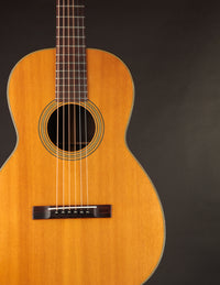 Martin acoustic guitar on a black background