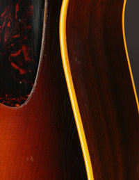Close up of binding on a 1947 Gibson LG-2 acoustic guitar with a sunburst finish