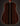 Acoustic guitar with a natural finish on a black background, back view