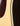 Close up of binding and pickguard on an acoustic guitar 