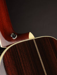 Close-up of a guitar's neck on a dark background
