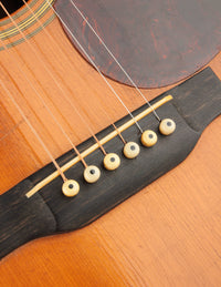 Close-up of a guitar's soundhole and strings