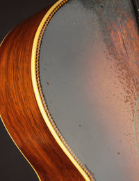 Close-up of a guitar's soundhole and wooden body