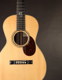 Acoustic guitar on a black background