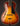 Archtop guitar with a sunburst finish on a dark background