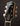 Close-up of a guitar headstock with 'Collings' branding on a dark background