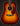 Acoustic guitar with a sunburst finish on a black background