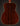 Back view of a wooden acoustic guitar with a dark brown finish on a black background