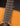 Close-up of an acoustic guitar's fretboard and soundhole