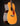 Acoustic guitar with a dark brown finish on a black background