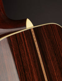 Close-up of a guitar's neck heel and back.