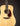 Acoustic guitar with a natural wood finish on a dark background