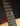 Close-up of a guitar's fretboard with a dark background