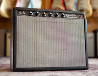 Fender Princeton Reverb with guitars in the background