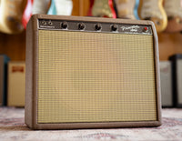 Fender guitar amplifier with guitars in the background