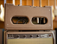 Fender reverb unit with guitars in the background