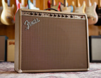 Fender guitar amplifier with guitar in the background