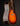 Acoustic guitar with a sunburst finish on a dark background