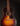 Acoustic guitar with a dark brown finish on a black background