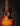 Acoustic guitar with a dark brown finish on a black background