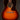 Acoustic guitar with a sunburst finish on a dark background