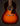 Acoustic guitar with a sunburst finish on a dark background