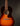 Acoustic guitar with a sunburst finish on a dark background