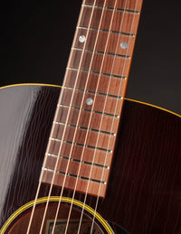 Close-up of a guitar's neck and soundhole