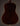 Back view of a dark brown acoustic guitar on a dark background