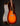 Acoustic guitar with a sunburst finish on a dark background, side view 