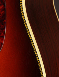 Close up binding on a sunburst acoustic guitar