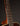 Close-up of a guitar neck with dark background