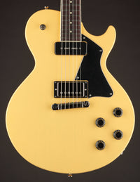 TV yellow Collings 290 electric guitar with black pickguard on a dark background