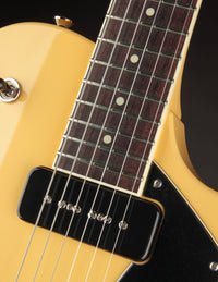 Close up of neck pickup on a TV yellow Collings 290 electric guitar 