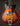 Electric guitar with a sunburst finish on a dark background