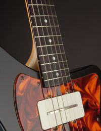 Close-up of a guitar.