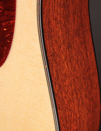 Close up of binding on an acoustic guitar 