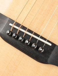 Close-up of a guitar's bridge