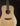 Acoustic guitar with a natural finish on a black background